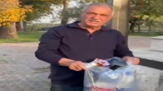 Şehitliğe saygısızlık yapanlara tepki gösterdi, çöpleri tek tek topladı